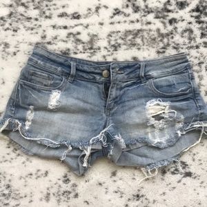Low rise distressed denim shorts